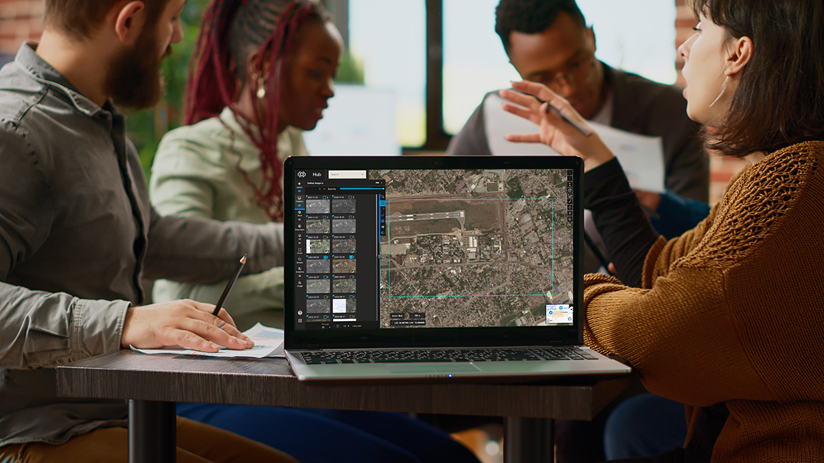 Professional team working with high-resolution satellite imagery